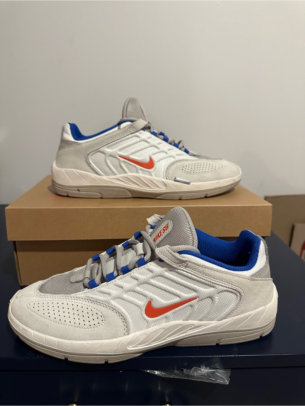 Nike Men’s White Sneakers with Orange Swoosh and Blue Accents